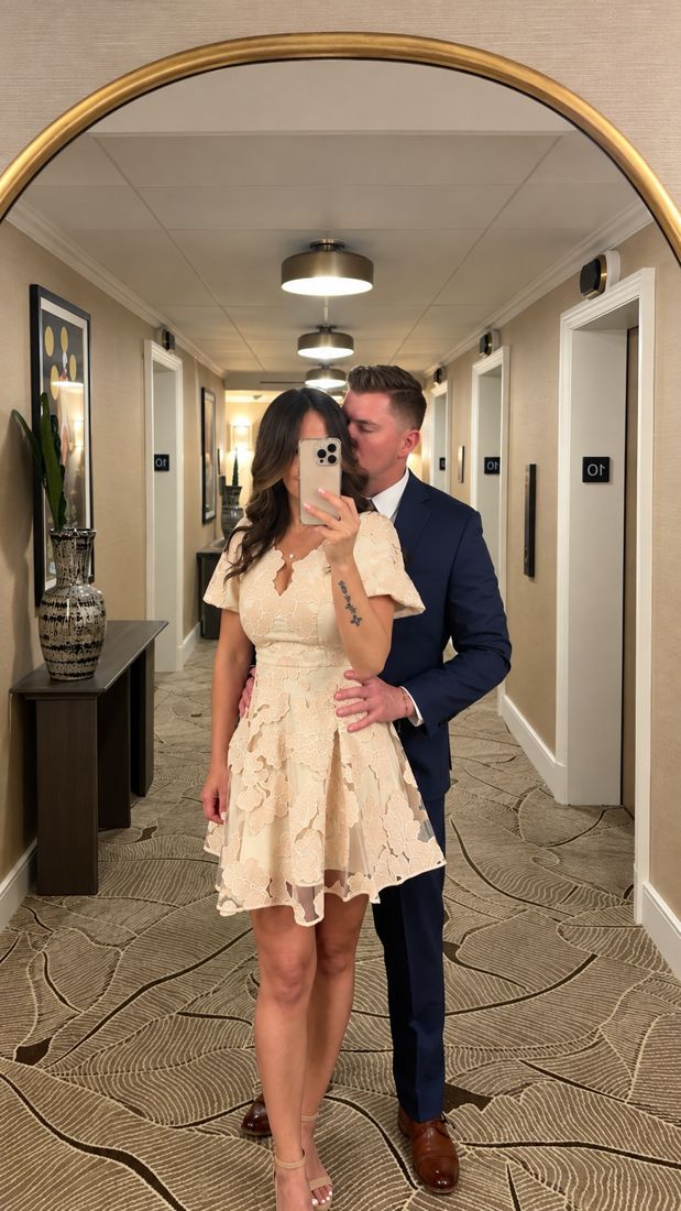 Ryan and Wendy in a hotel hallway mirror, dressed up