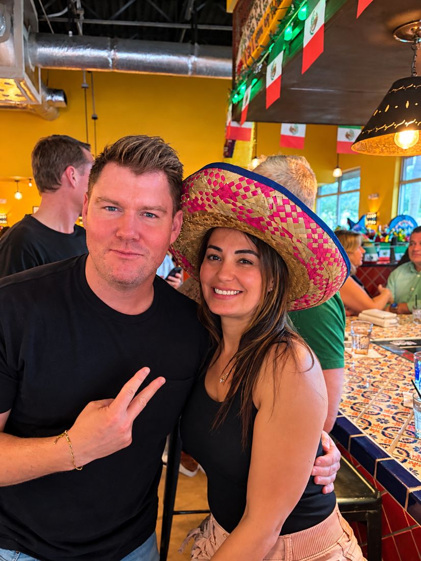 Ryan and Wendy at a restaurant, Wendy in a sombrero