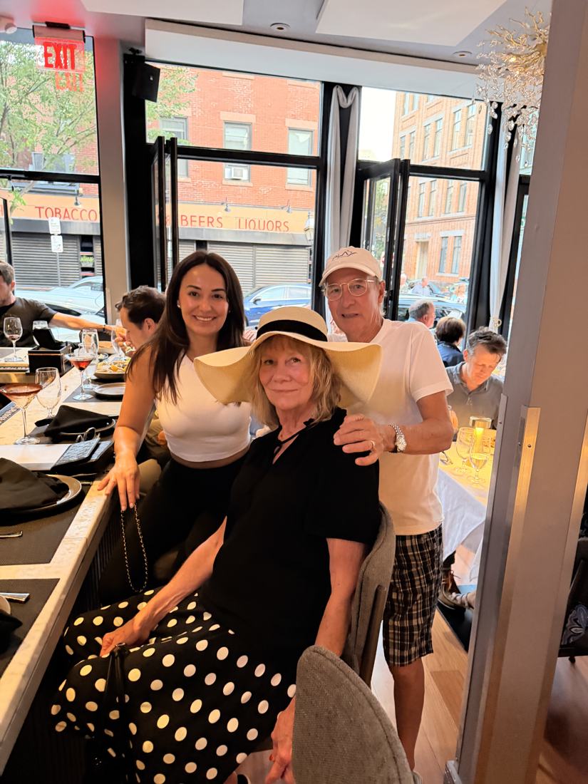 Wendy with family at a restaurant